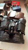 Group of binoculars, opera glasses and Zoomex 8 mm cine camera