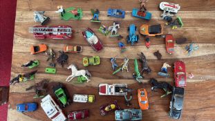 Group of vintage Dinky and Corgi die-cast vehicles with figures, c.1960s-70s
