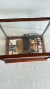 Scale model of 1886 Benz Patent-Motorwagen in display case