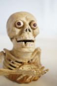 Cast iron skeleton money box