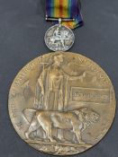 WWI memorial plaque 'Norman Jones' together with a