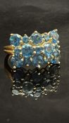 9ct Gold ring set with blue zircon - 15 stones in
