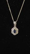 14ct white gold pendant set with diamond & centra