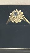9ct Gold ring set with blue topaz & diamonds 0.25