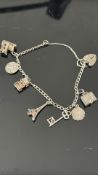 Silver charm bracelet with 7 charms & heart shaped
