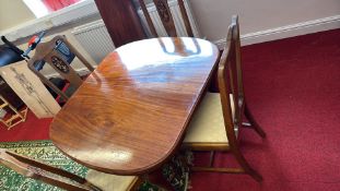 Mahogany extending dining table and four chairs