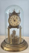 German Brass 400-day torsion mantel clock, Arabic chapter ring, four finials and turned column