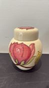 Moorcroft tubelined floral earthenware covered jar