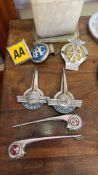 Collection of British automotive badges and handles