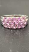 9ct White gold ring set with 16 pink gemstones Weight 4.6g Size R
