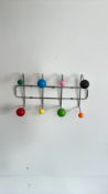 Chromed coat rack with multicoloured ball hooks