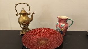 Brass spirit kettle, red ceramic charger and floral earthenware jug (3)