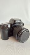 Canon EOS 1000F SLR with 35â€“80 mm and 75 300 mm EF lenses