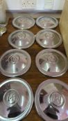 Eight vintage chrome hubcaps: Morris Minor and Wolseley