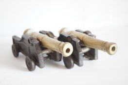 Pair of brass & cast iron cannons