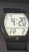 Black plastic wristwatch with oversized curved E-ink digital display, day/date and alarm indicators;