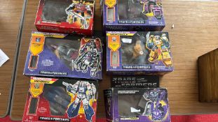 Group of six boxed Hasbro â€œTransformersâ€ Generation 1 figures, 1985â€“87
