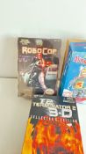 Three boxed sci-fi robot/action figure toys, Robocop is sealed and robot is a tin plate wind up toy
