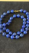 Lapis lazuli stone beads with 9ct gold clasp