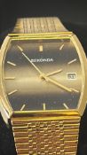 Sekonda gold-tone quartz wristwatch, rectangular gradient dial, baton hour markers, date window at 3