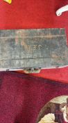 Vintage black-painted steel trunk with initials “J.E.B.”