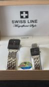Presentation box containing matching Swiss Line quartz wristwatches, gents and ladies models,
