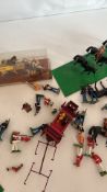 Collection of painted lead toy soldiers, cavalry and carriage, c.1940s-60s