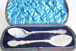 Pair of cased Victorian sugar spoons