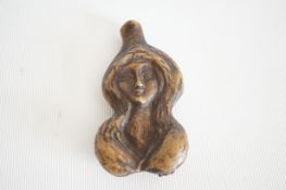 Bronze erotic sculpture a woman's face with erotic