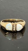 9ct Gold ring set with 3 diamonds & 2 opals Weight