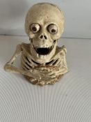 Cast iron skeleton money box mechanical popping pu
