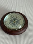 Floating compass in wooden surround