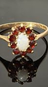9ct Gold ring set with central opal surrounded by