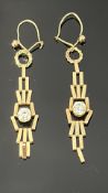 Pair of gold earrings set with white stones weight