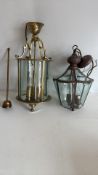 Pair of brass and patinated metal glazed hanging lanterns