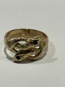 9ct Gold ring with snake design, 2 garnets as snak