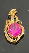 Gold pendant set with pink stone, hallmarked rubbe