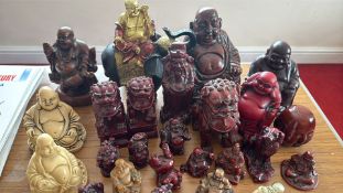 Collection of Chinese-style Buddha and guardian lion resin figurines (c.30 pieces)