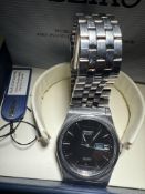 Seiko quarts SQ100 with day/date app wristwatch