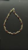9ct Gold diamond & garnet bracelet Weight 5.5g