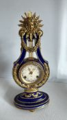 French gilt bronze and cobalt porcelain lyre mantel clock