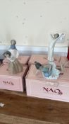 Set of four boxed NAO by LladrÃ³ porcelain figurines