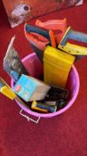 Bucket of assorted hand tools and accessories