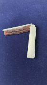 White metal early 20th century folding comb