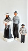Signed trio of hand-painted terracotta folk figures