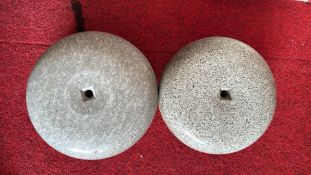 Two small granite curling stones