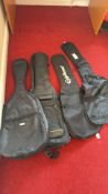 Four guitar gig bags, one Epiphone