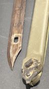 Soviet AKM Type II bayonet with wire-cutter scabbard and canvas sling, accompanied by Soviet olive-