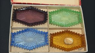 Boxed set of four Bohemia coloured glass dishes