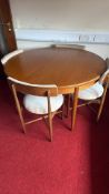 G-Plan Teak round extending dining table with four chairs, c.1960s